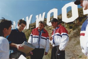 Joe Toplyn, Jay Leno, and Charlie Sheen discuss a stunt at the foot of the Hollywood Sign.