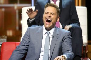 Rob Lowe laughing at a roast joke