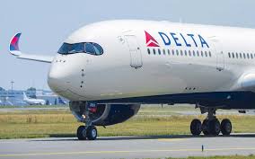 A Delta passenger jet on the runway