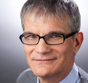 Headshot of Joe Toplyn smiling